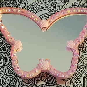 Mirror with storage on back.